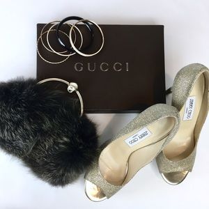 Gucci Fur Clutch With Gold Handle